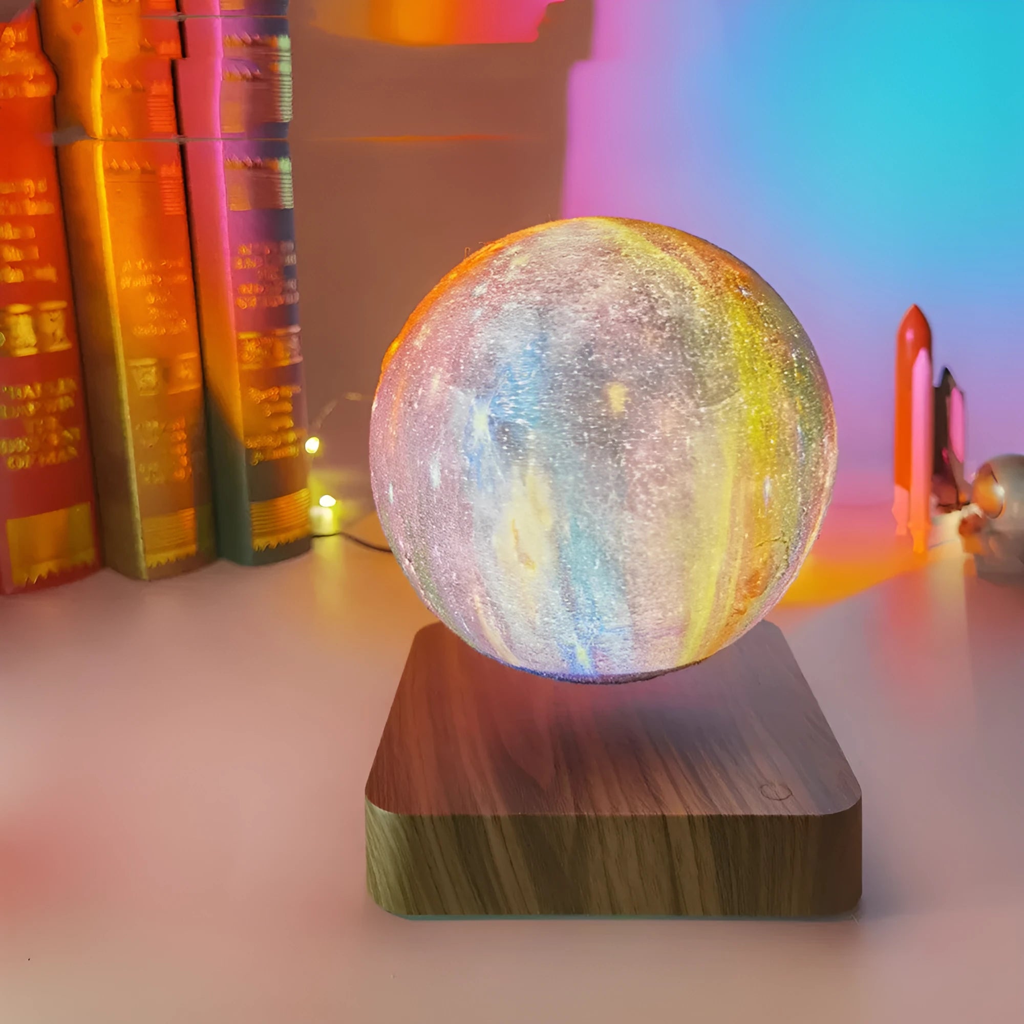 Magnetic levitation galaxy decorative light with a floating walnut-coloured moon lamp above a circular base.