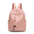 Women's black nylon casual backpack with double shoulder straps and front pocket