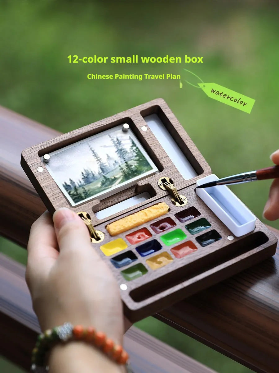 Mini walnut wooden box open to show watercolour pigment pans from Holbein, Schminke, Picasso, or Moonlight Treasure Box sets.
