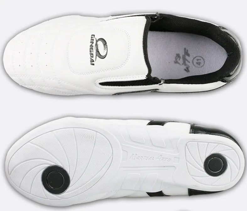 Black and white children's martial arts training shoes with a soft bottom and widened fit for Sanda and Taekwondo.