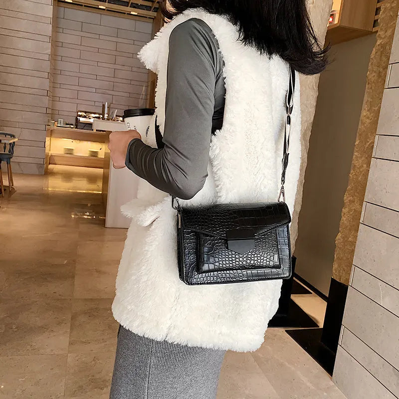 Vintage-style crossbody bag in PU material showing black, brown, khaki and red colour options
