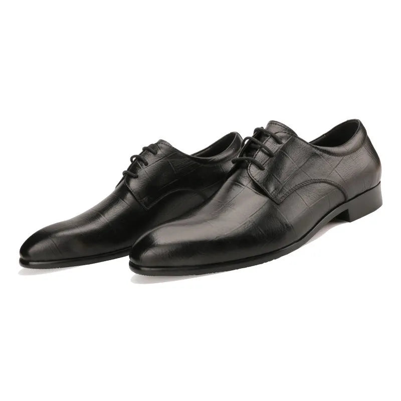 Men's black leather derby shoes with checkered detailing and pointed toe