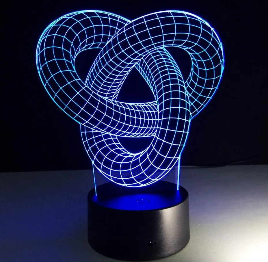 Knot 2 3D optical illusion LED lamp hologram with remote control and touch operation on a table