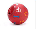 Rubber puzzle ball for dogs with uneven surface, footprints pattern, blue and red colours, sizes 7.5cm and 11cm