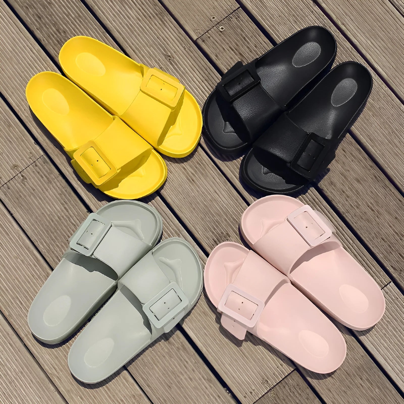 Women's grey blue buckle flip-flop sandals with a soft EVA sole on a plain background