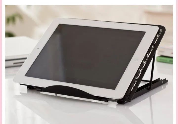 Adjustable steel laptop stand in silver, folded flat, showing spray-coated finish and gear mechanism.