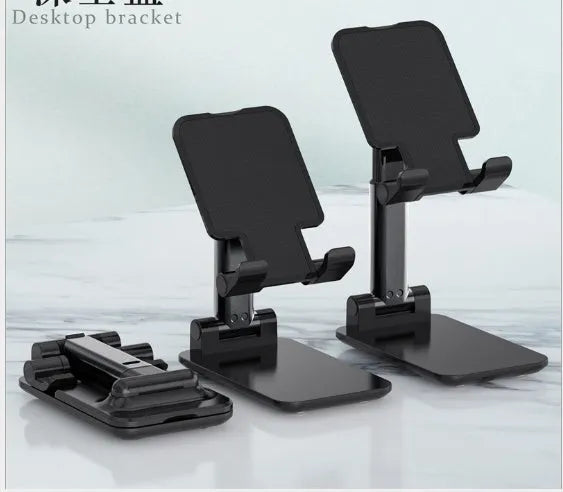 Black adjustable desk mobile phone holder with silicone grip on a wooden desk