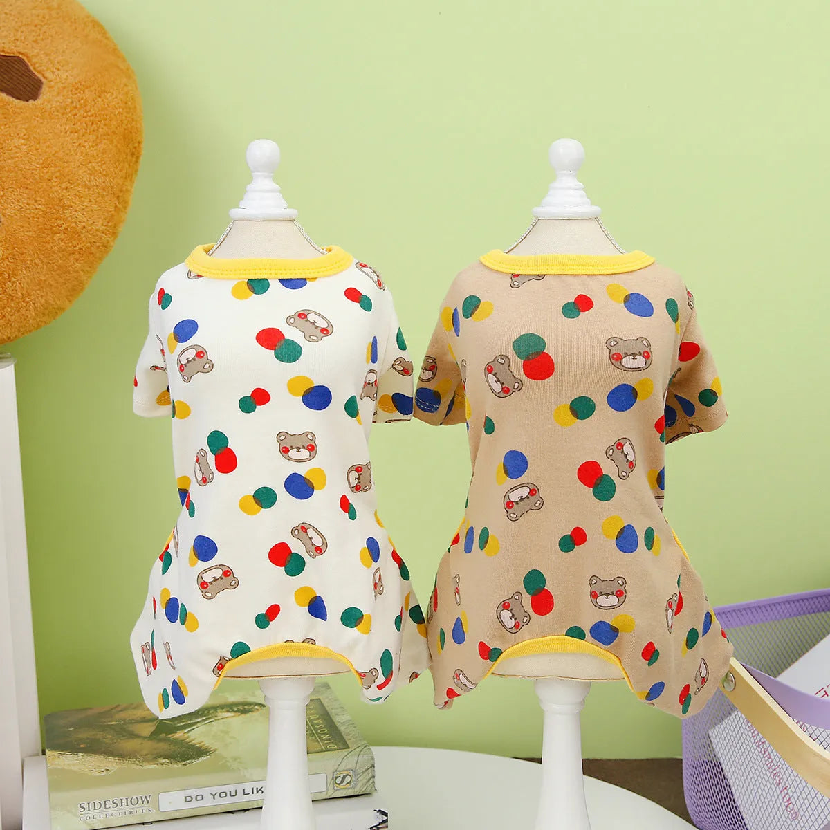 Beige dog jumper with colourful ball bear print, made from cotton and spandex.
