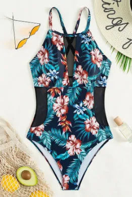 Women's deep V-neck one-piece swimsuit in a solid colour or gradient pattern.