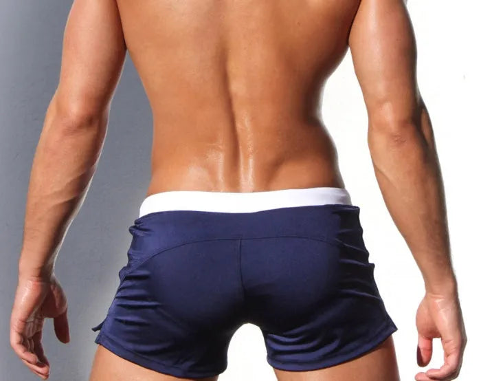 Men's nylon swim shorts with drawstring waist in black, blue, lake blue, orange, red, and A colour options.