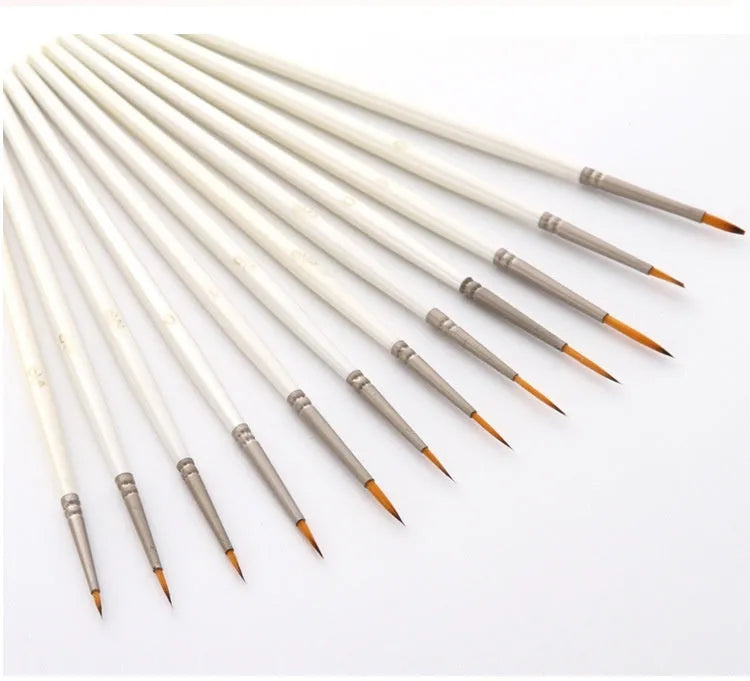 A 12-piece set of Pearl White artist brushes with a solid wood pen holder.