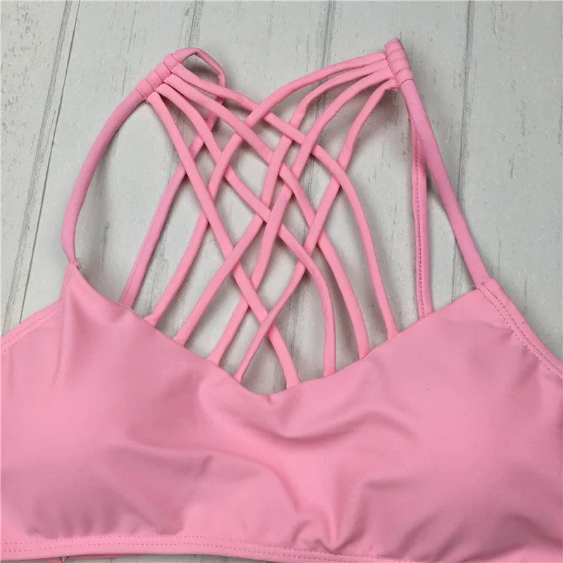 Women's pink cut out halter bikini swimsuit with bandage design and cross front details