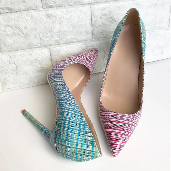 Women's pink and blue gradient patent leather stiletto heels with a pointed toe on a rubber sole.
