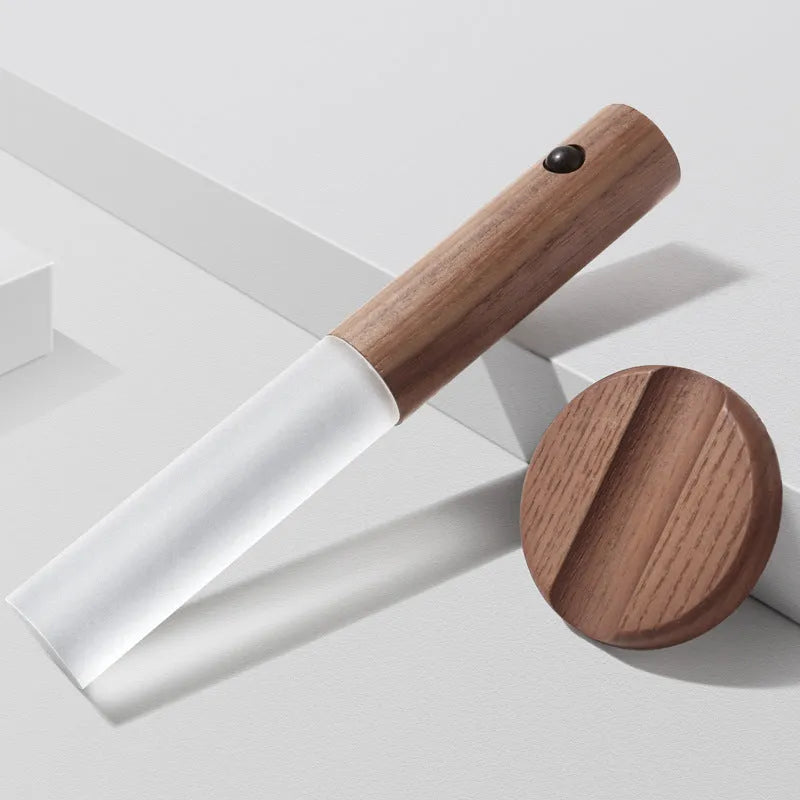 Smart motion sensor LED desk lamp made of solid wood and acrylic with a rechargeable battery.