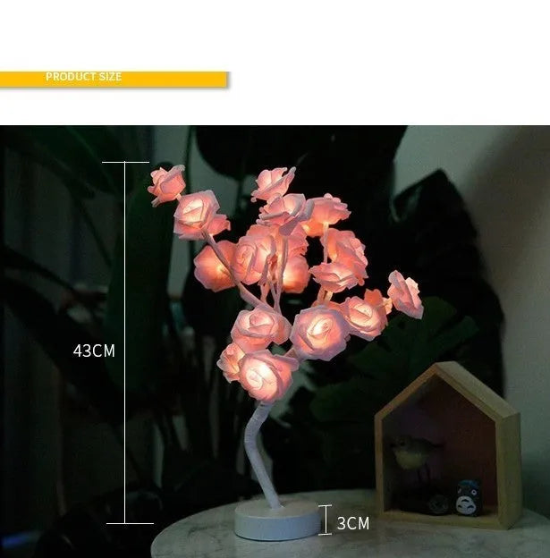 Rose flower LED table lamp with warm white glow on a flat surface, showing PE cotton flowers and bonsai tree shape