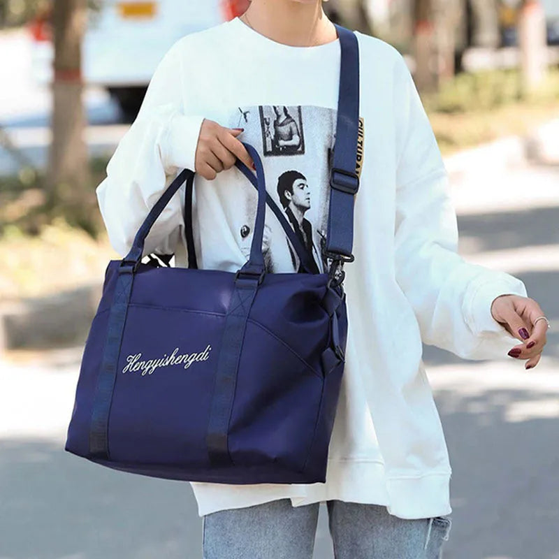 Medium 36-55L Oxford cloth travel duffel bag with zip pockets, soft handle, available in blue, black, grey and pink.