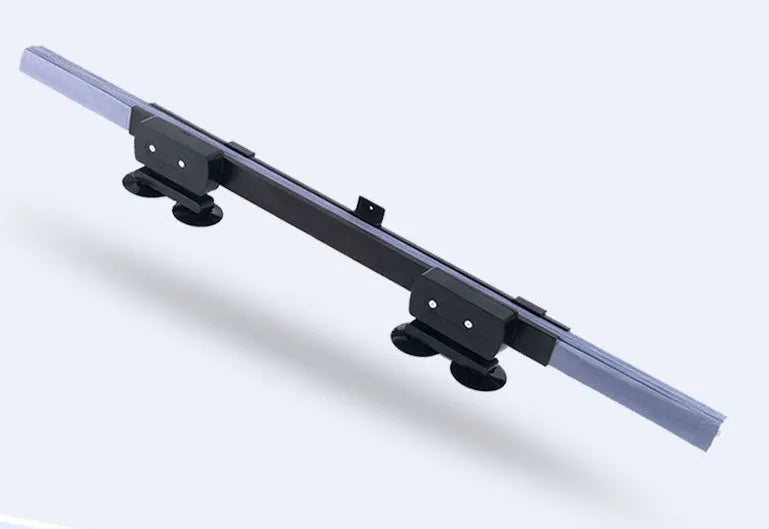 Car sun visor of aluminised film measuring 46cm sliding into position on a car windscreen