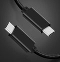 Black nylon braided USB-C data cable with metal shell, supporting 100W charging and 4K video output