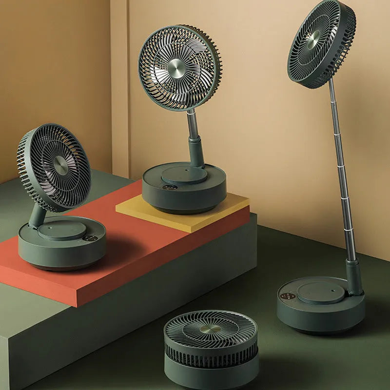 Green telescopic floor fan extended to full height with remote control resting beside base