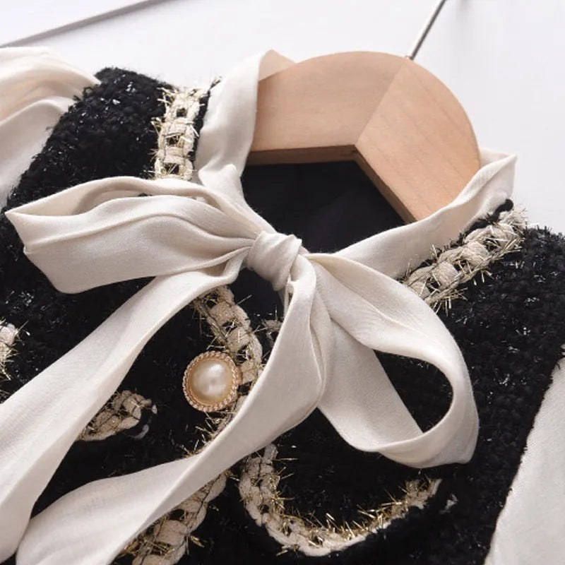 Children's black princess dress with long sleeves and stitching design on polyester fabric