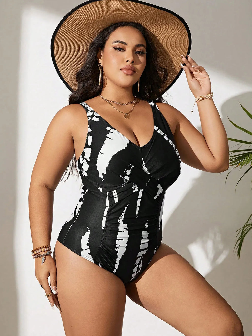 Black Siamese colour matching fit one-piece swimsuit on a hanger.