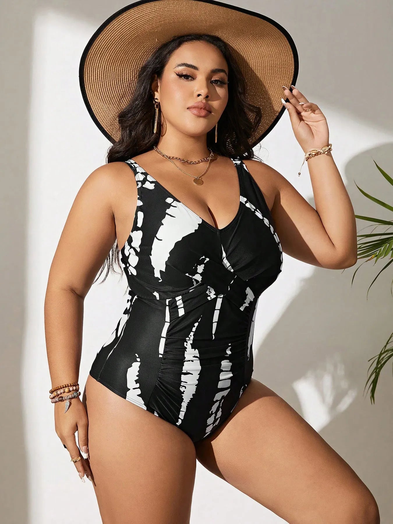 Black Siamese colour matching fit one-piece swimsuit on a hanger.