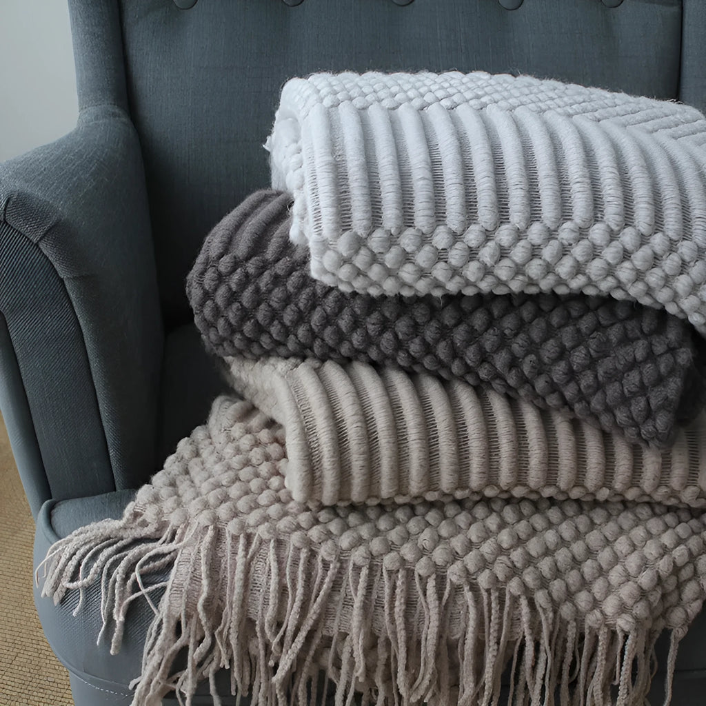 Small light grey polyester nap blanket laid flat showing 127x170cm size.