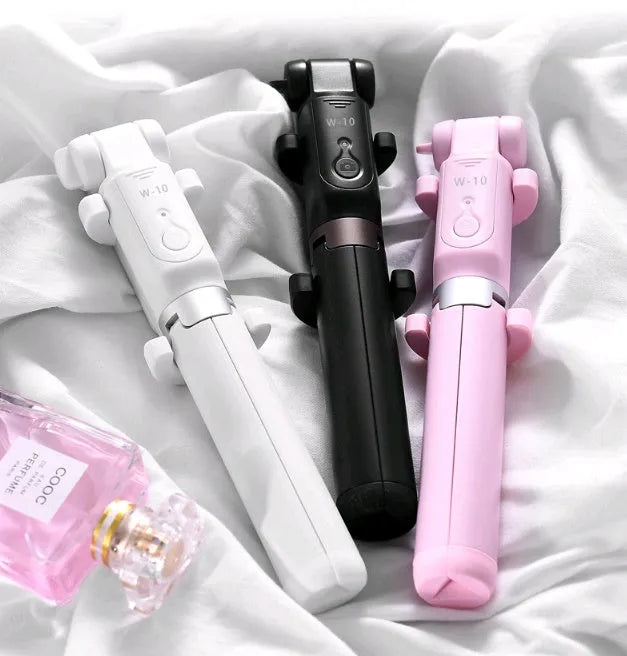 Black Bluetooth selfie stick with tripod bracket extended, holding smartphone