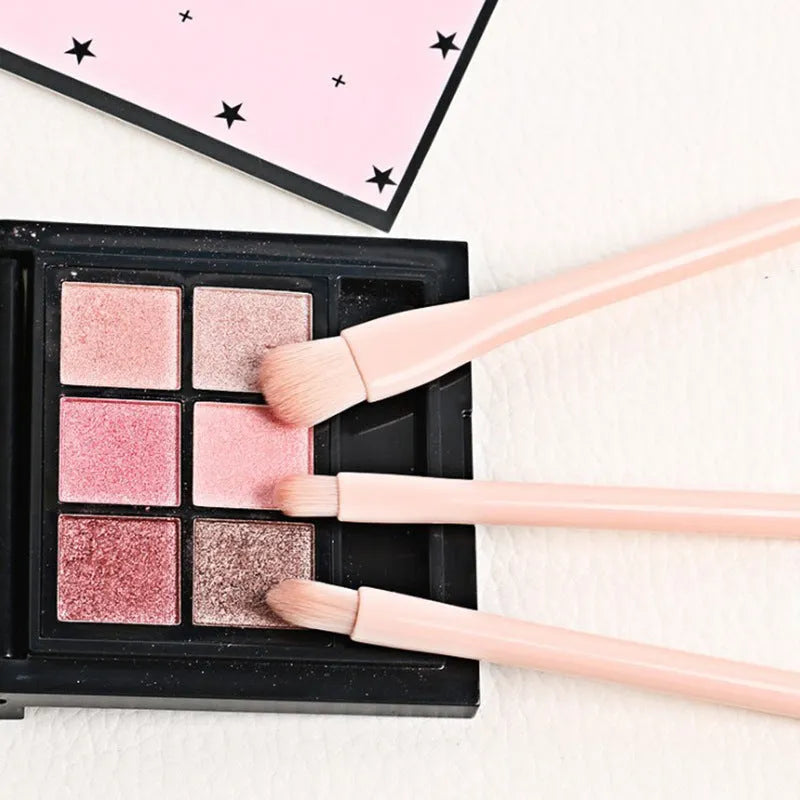Single 4-in-1 retractable makeup brush set with four skin-colour bristle heads, 14cm total length, on a white background