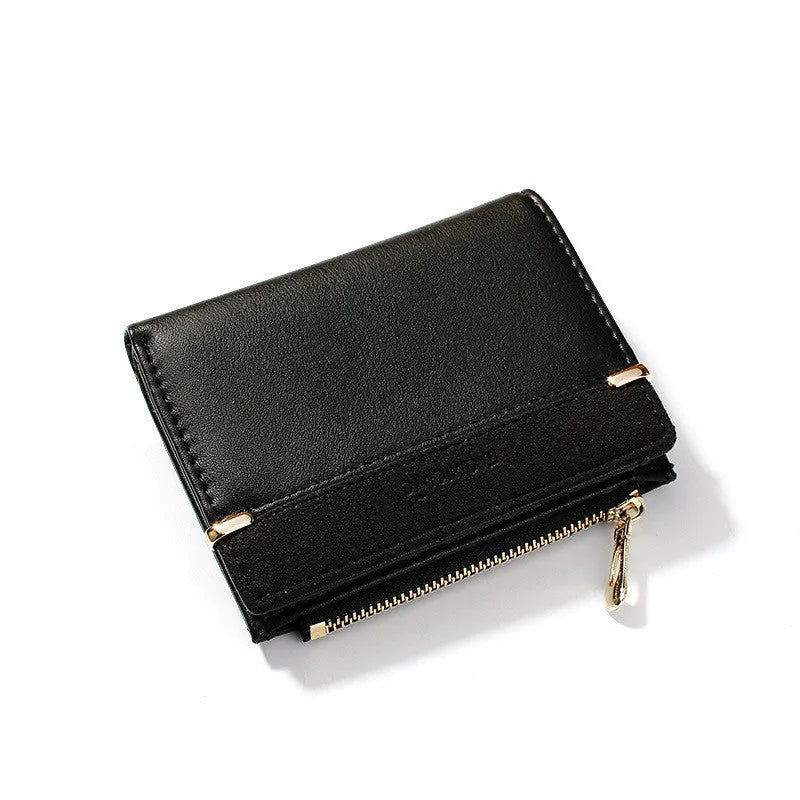 Short black ladies wallet with zipper, open to show multiple card slots, bill holder, and change compartment.