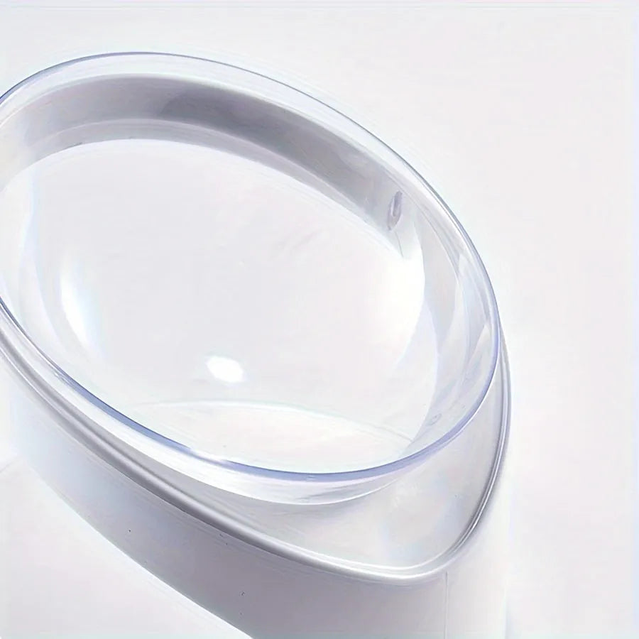 Clear plastic elevated cat food bowl with a tilted feeding platform.