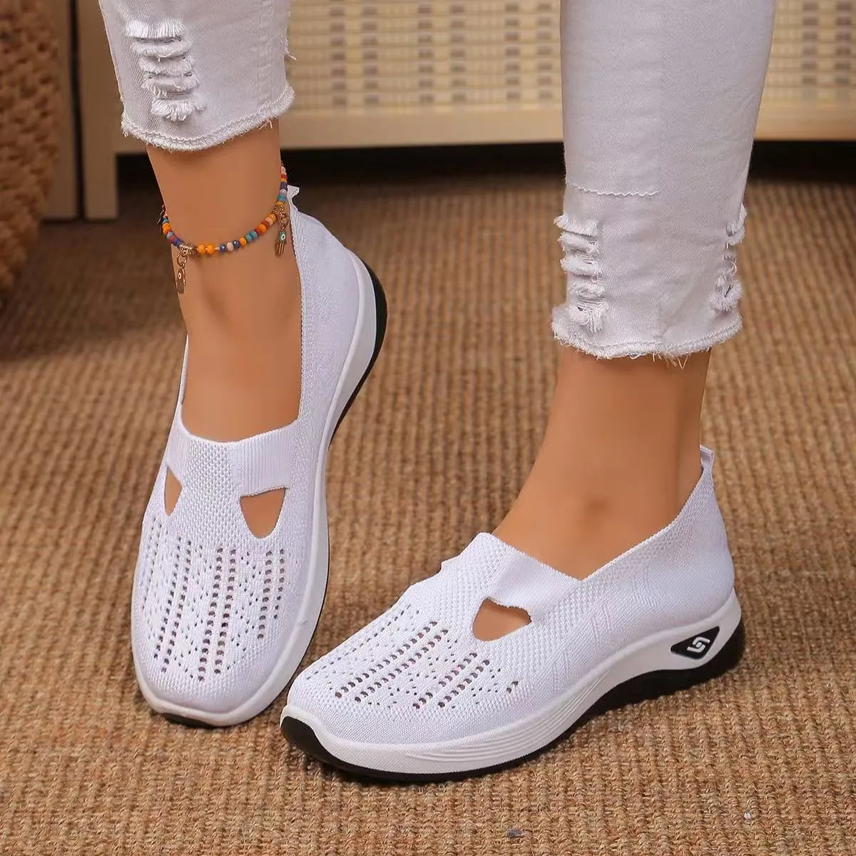 Women's light grey mesh casual flats with a T-strap and round toe on a soft PVC sole.