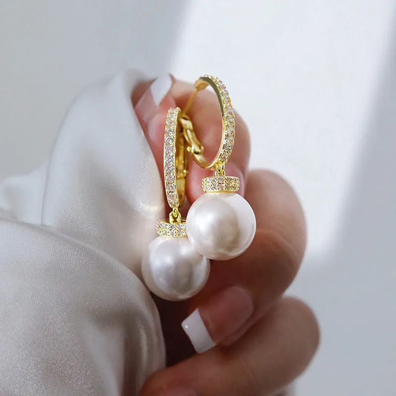 Yellow gold finish earrings with imitation pearls and inlaid zircon on copper base