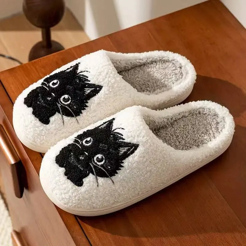 White plush slippers with Black Beard Cat cartoon couple design, showing thick construction and textured TPR sole.