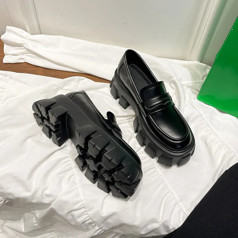 British style wide fit loafers in either matte or patent leather with distinctive muffin heel