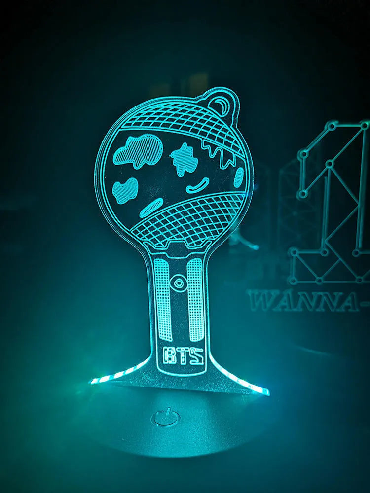 Clear acrylic display stand supporting 101 Tower Gem BTS lamp with universal voltage compatibility
