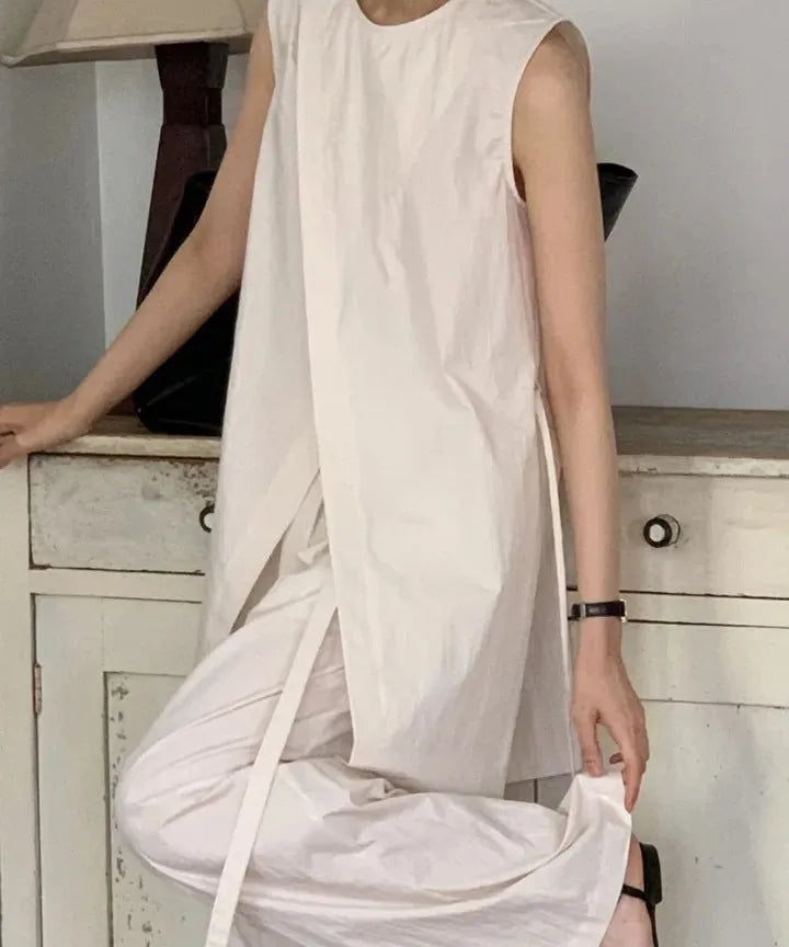 Split sleeveless lace-up top and high waist wide leg pants two-piece set in light apricot or black, average size