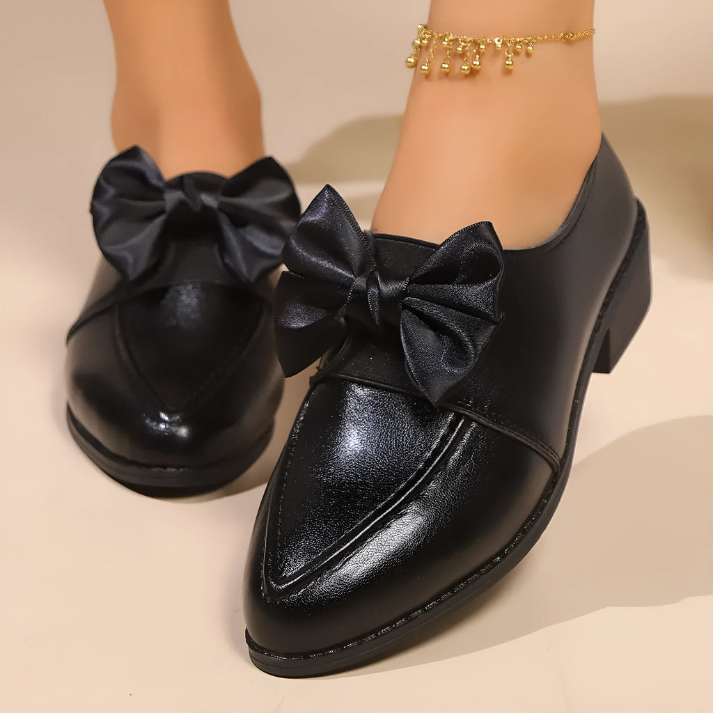 Women's British-style leather flats with bow decoration on pointed toe, showing three bow style options
