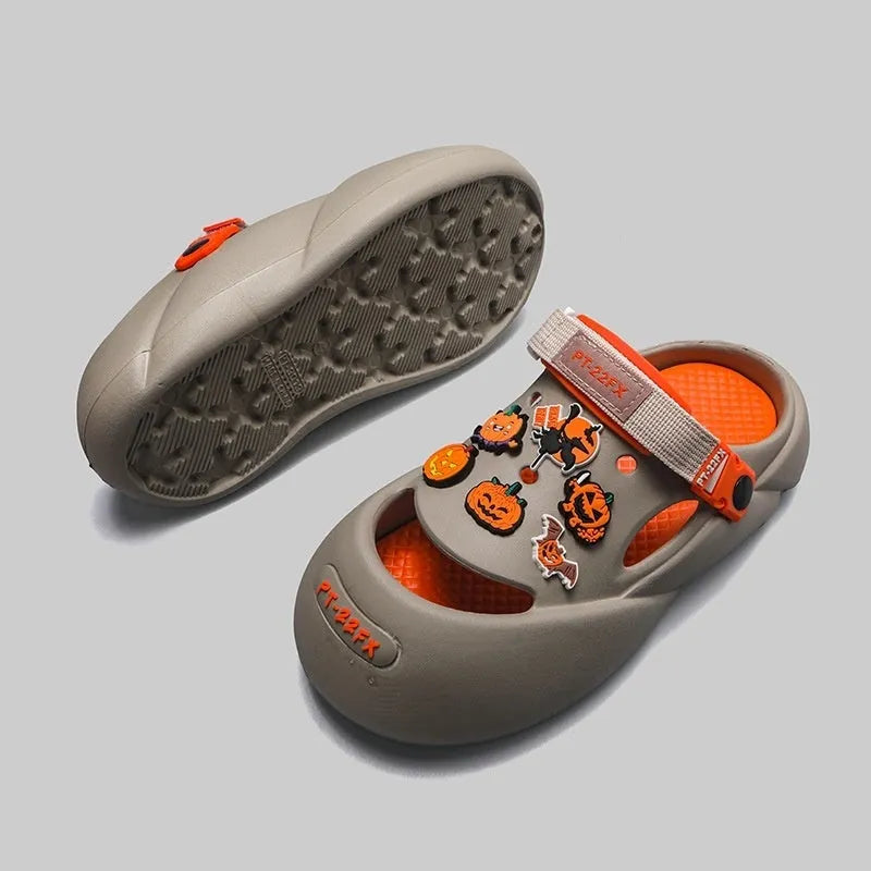 Men's grey beach shoes with open-hole design and covered toe protection on sandy surface