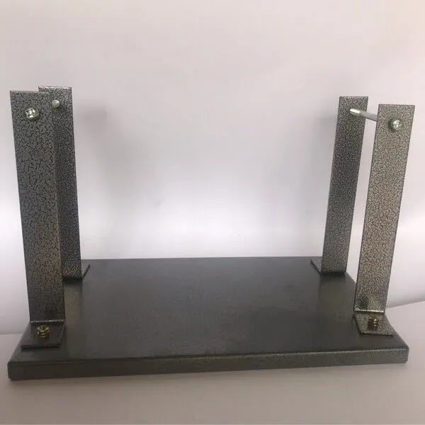 Black iron flip chip bracket for mounting a portable electric planer inverted.