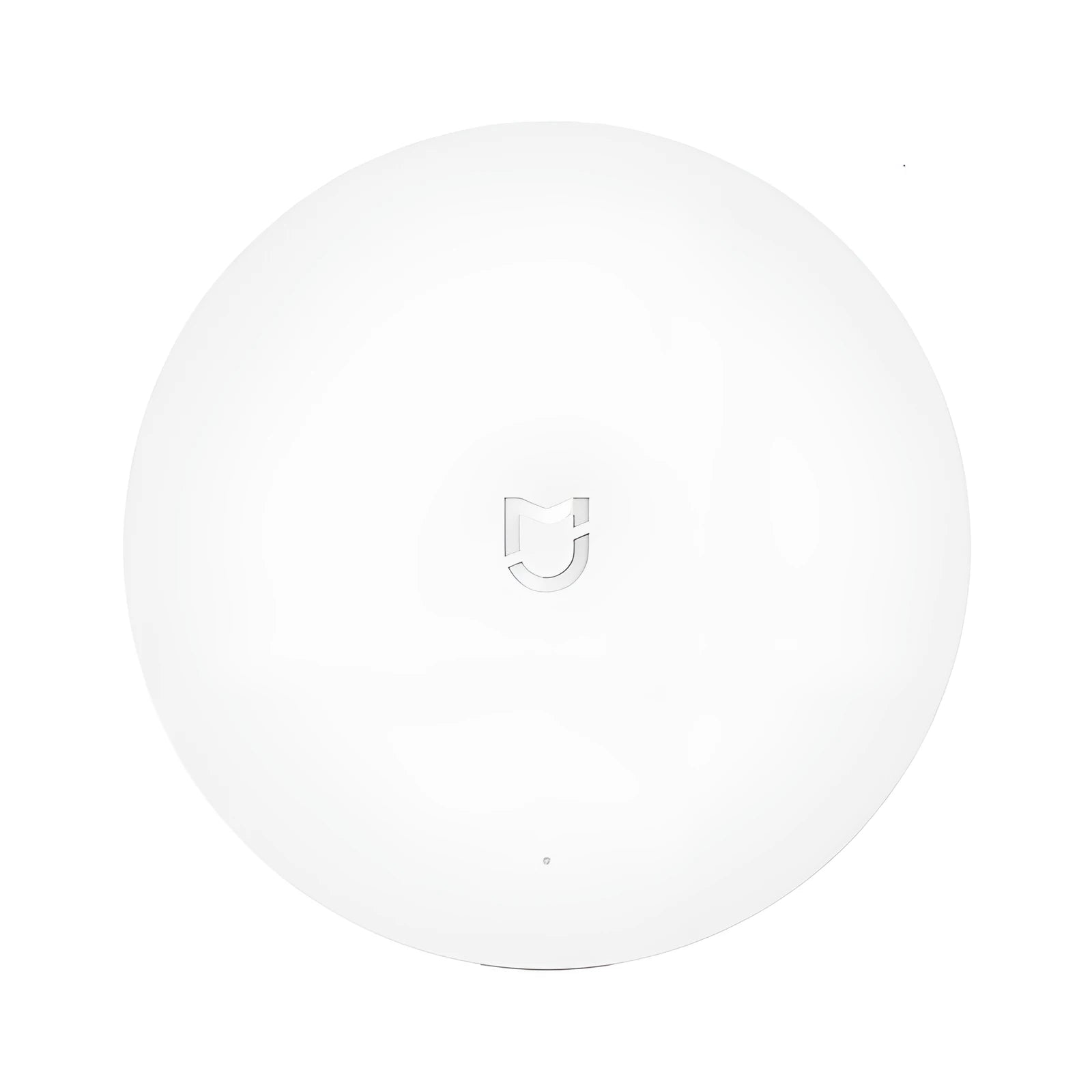 White circular smart home gateway with UK plug for wireless wall control