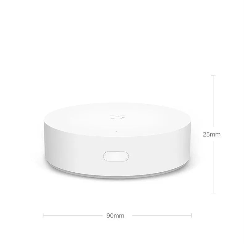 White circular smart home gateway with UK plug for wireless wall control
