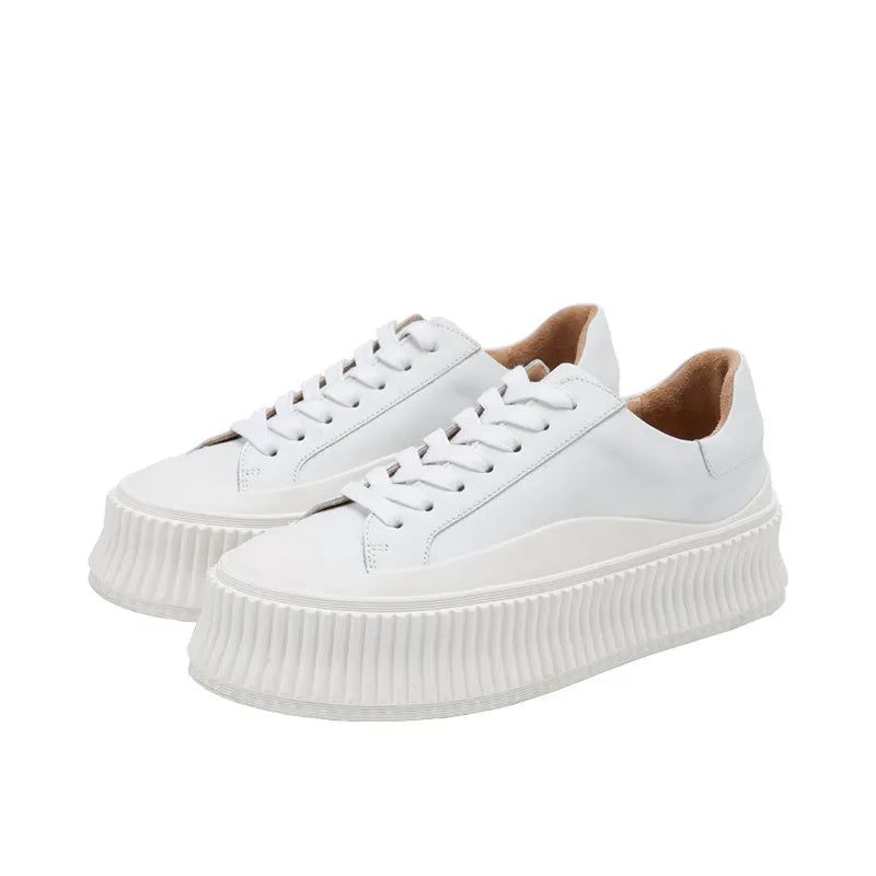 Women's black platform sneakers with back-lace fastening and thick rubber sole