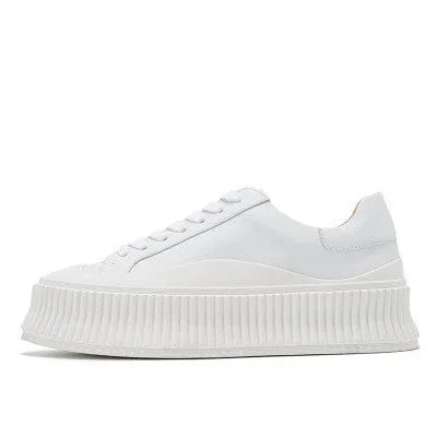 Women's black platform sneakers with back-lace fastening and thick rubber sole