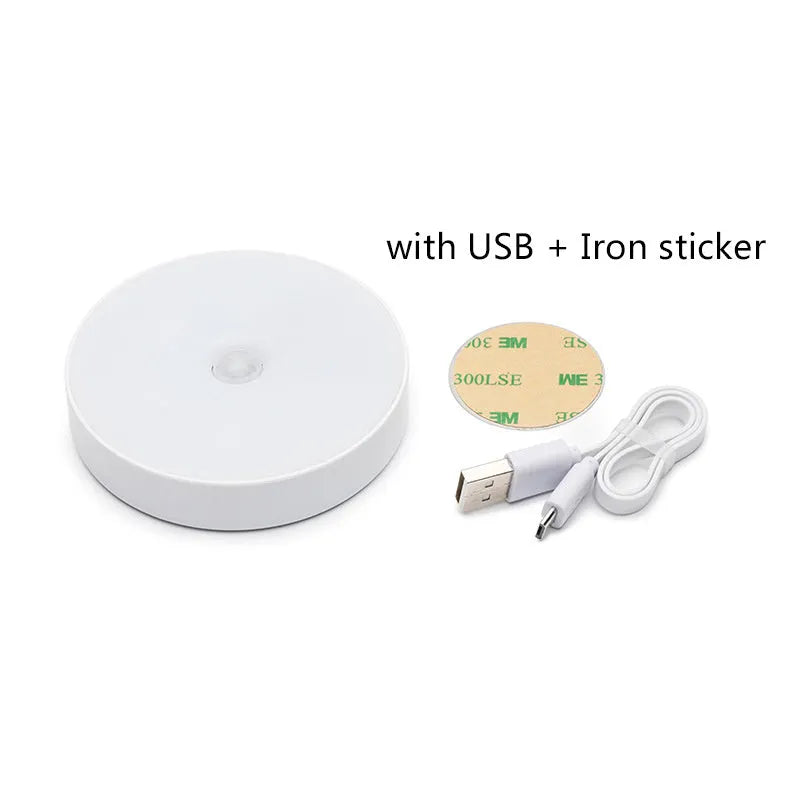 Small circular beige or white USB rechargeable body sensing LED night light with adhesive tape