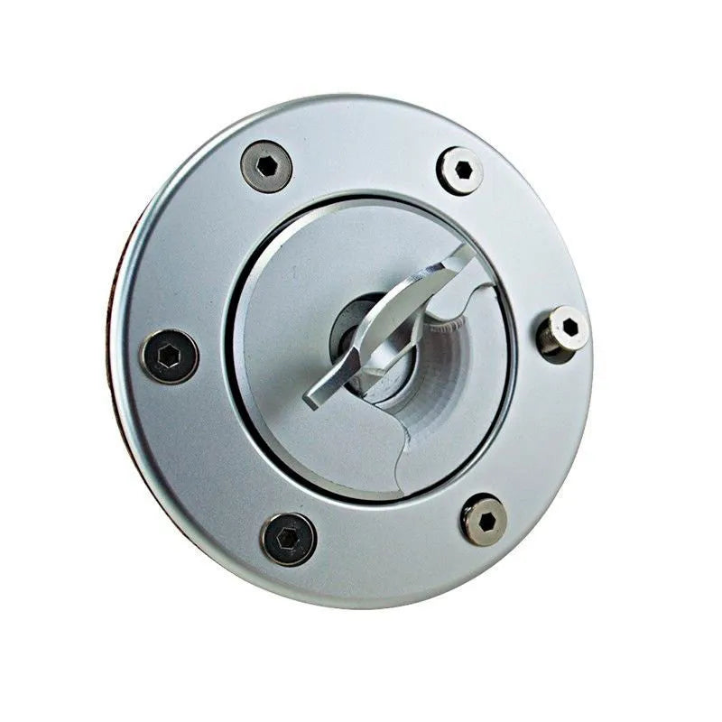Silver aluminium alloy universal car fuel tank cap on a white background