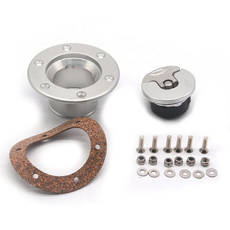 Silver aluminium alloy universal car fuel tank cap on a white background