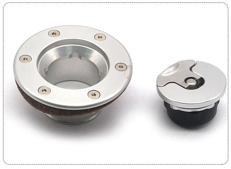 Silver aluminium alloy universal car fuel tank cap on a white background