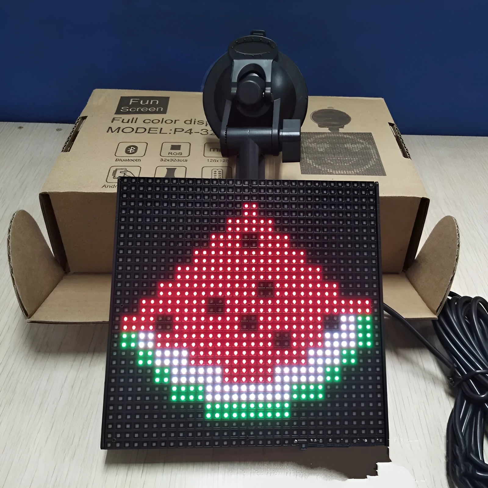 Full-colour 32x32 pixel Bluetooth car LED display showing a smiley face in horizontal scroll mode