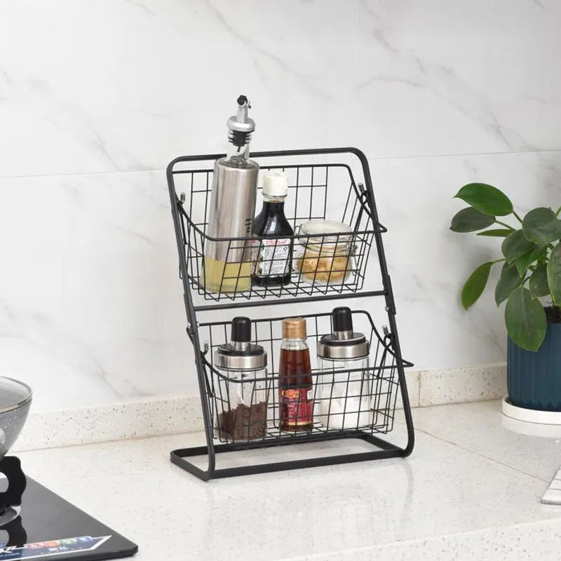 2-tier black iron kitchen storage rack with hollowed sides on countertop